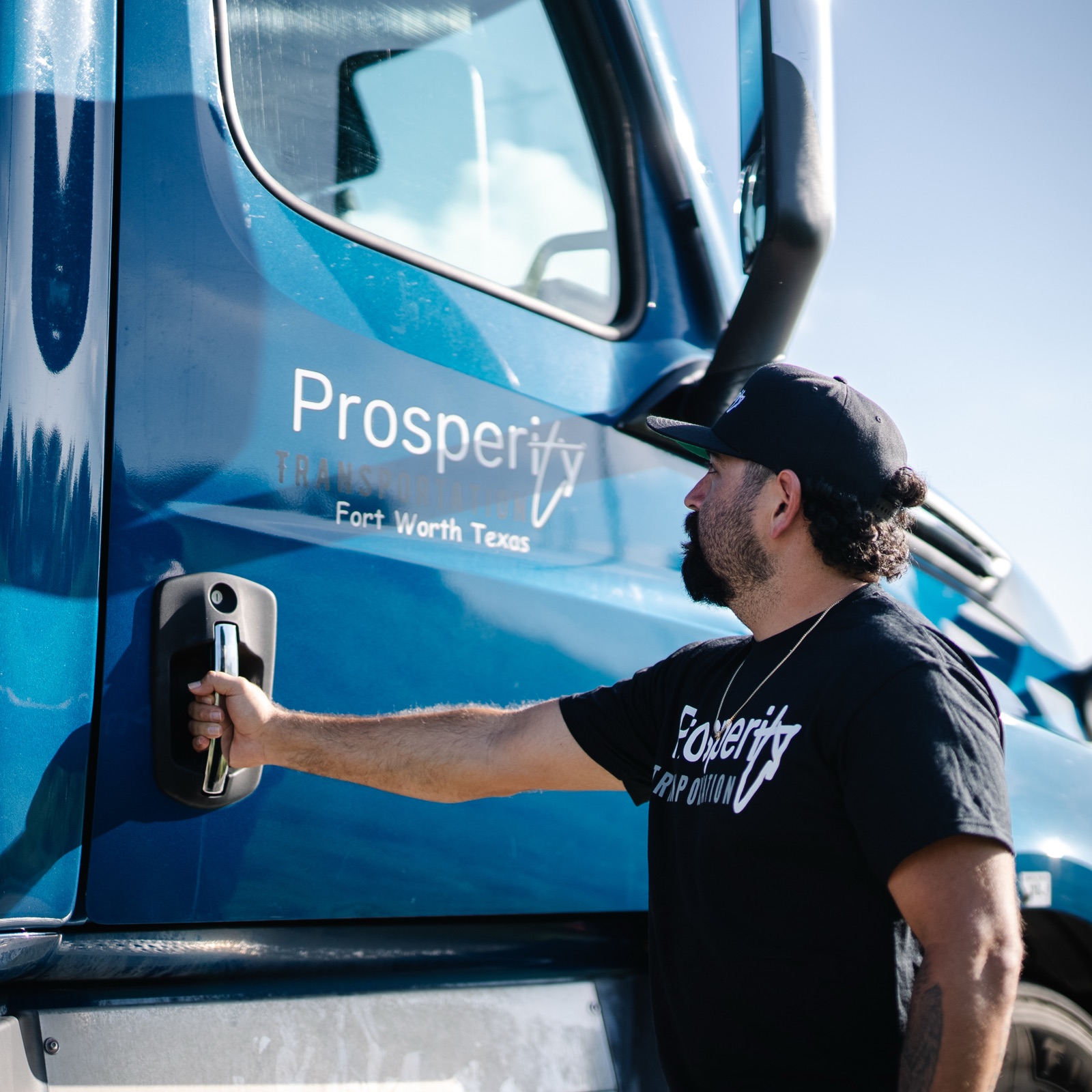 A Prosperity Transportation driver stepping into his truck