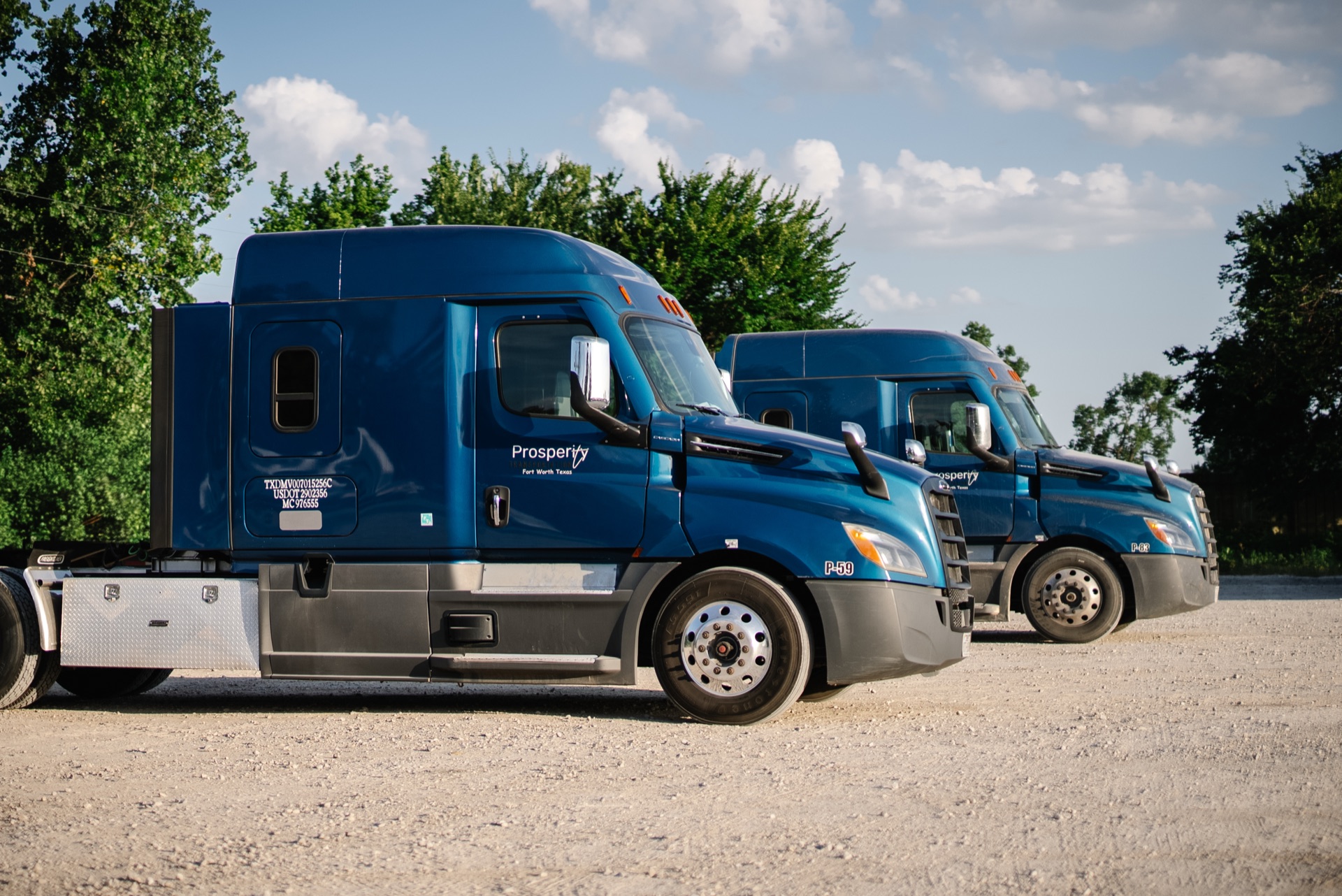 Prosperity Transportation fleet of blue trucks lined up